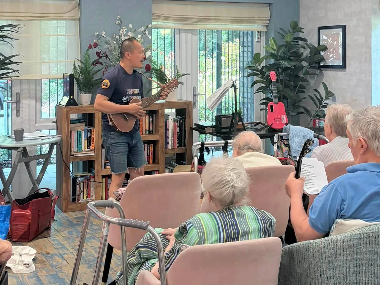 Residents joining a HappierMusic care-home sing-along